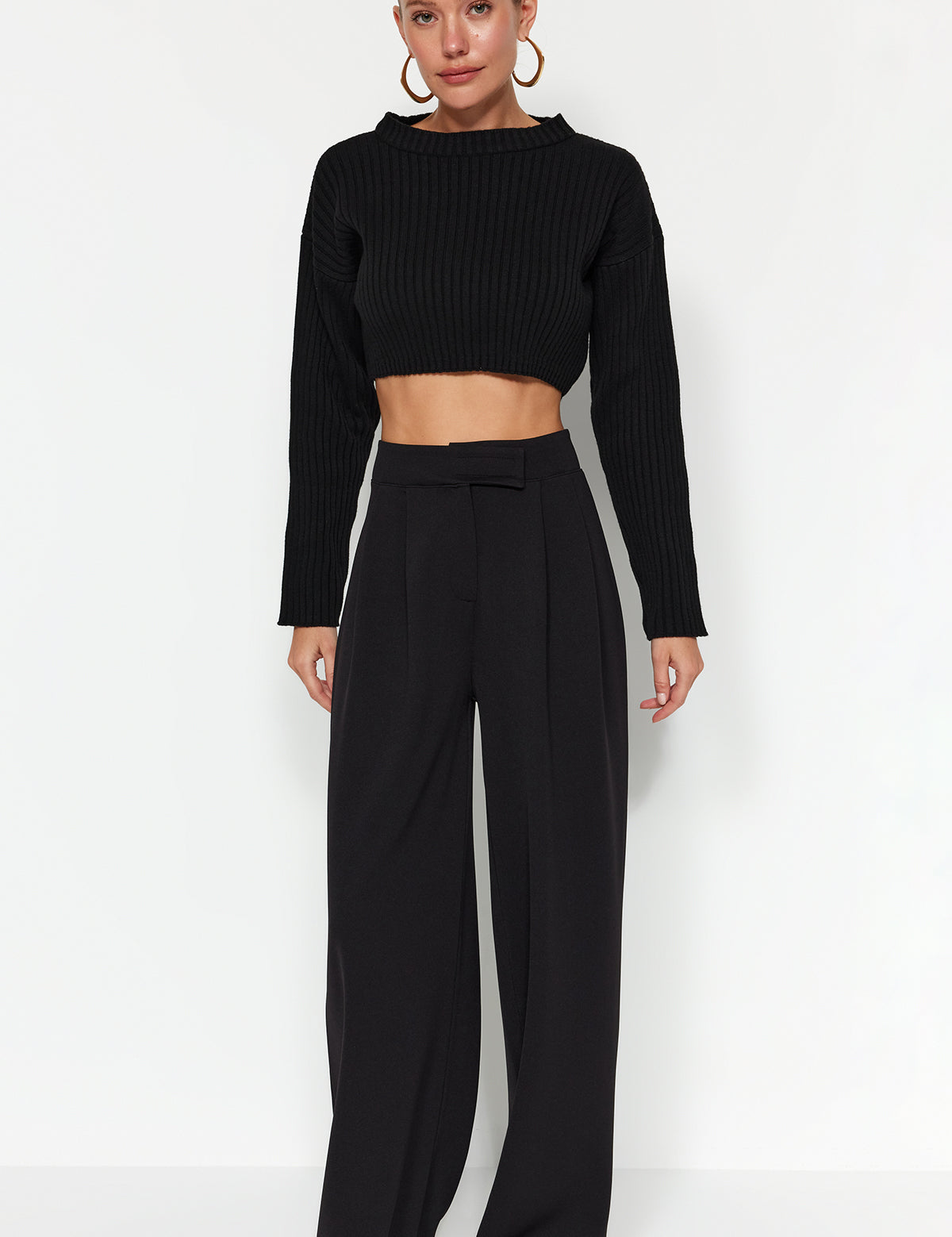 Elevate your style with our High-Waisted Wide Leg Trousers in black. These pleated dress pants offer a sophisticated, relaxed fit perfect for any occasion. Shop now for a timeless wardrobe staple!

