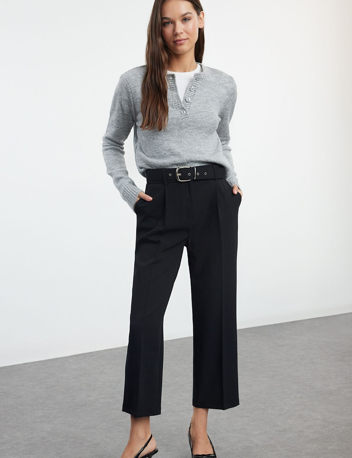 Upgrade your wardrobe with our Women’s High-Waisted Belted Black Trousers. Featuring a tailored fit, chic belt detail, and comfortable fabric, these versatile pants are perfect for both office and casual wear.