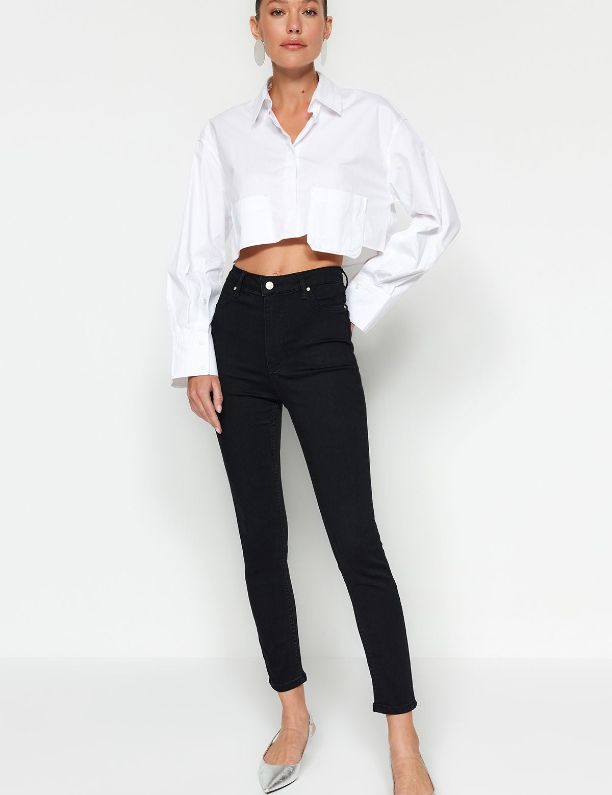 Shop our High-Waisted Black Skinny Jeans for women - the perfect blend of style, comfort, and versatility. Made from premium stretch denim, these jeans offer a flattering high-rise fit. Ideal for any occasion!
