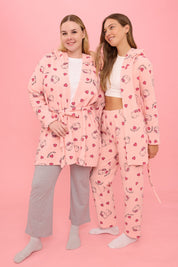 Stay cozy with our Hello Kitty fleece robe and matching pajama set. Featuring adorable heart prints, perfect for lounging or gifting. Shop now for ultimate comfort!