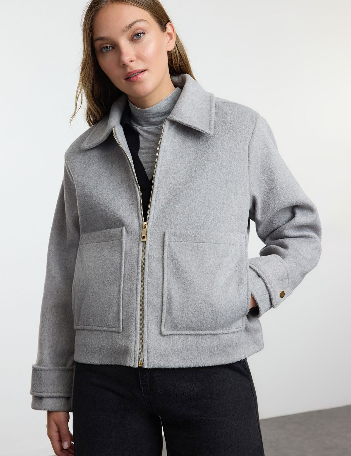 Upgrade your winter wardrobe with this classic gray wool blend zip-up jacket. Perfect for layering, it offers a warm and stylish touch to any outfit.