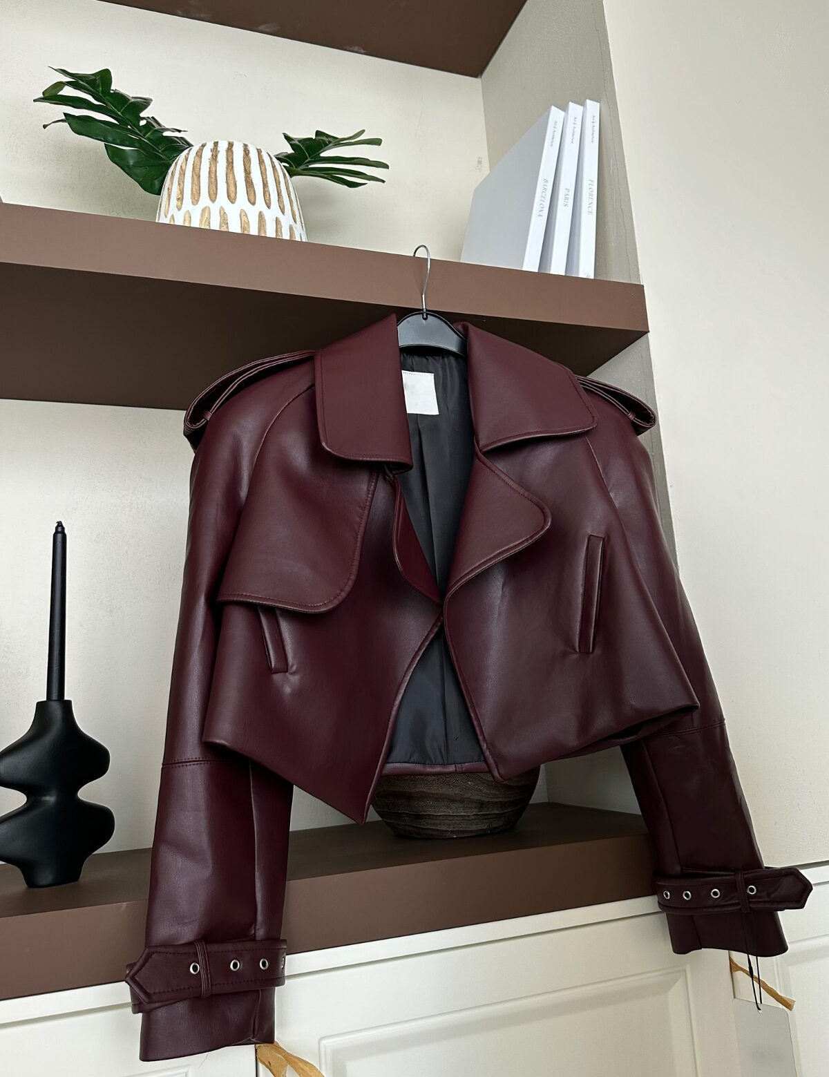 Cropped Burgundy Faux Leather Jacket – Trendy Outerwear for Women 
Explore our cropped burgundy faux leather jacket with oversized lapels and belted cuffs. The perfect blend of bold and stylish outerwear for your wardrobe.