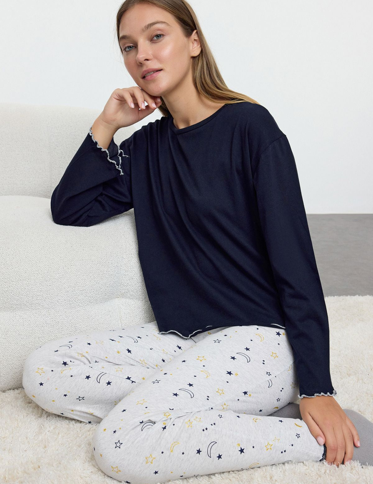 Relax in comfort with our celestial pajama set. Featuring a navy top and moon-and-star print pants, perfect for cozy nights in or as a thoughtful gift. Shop now!