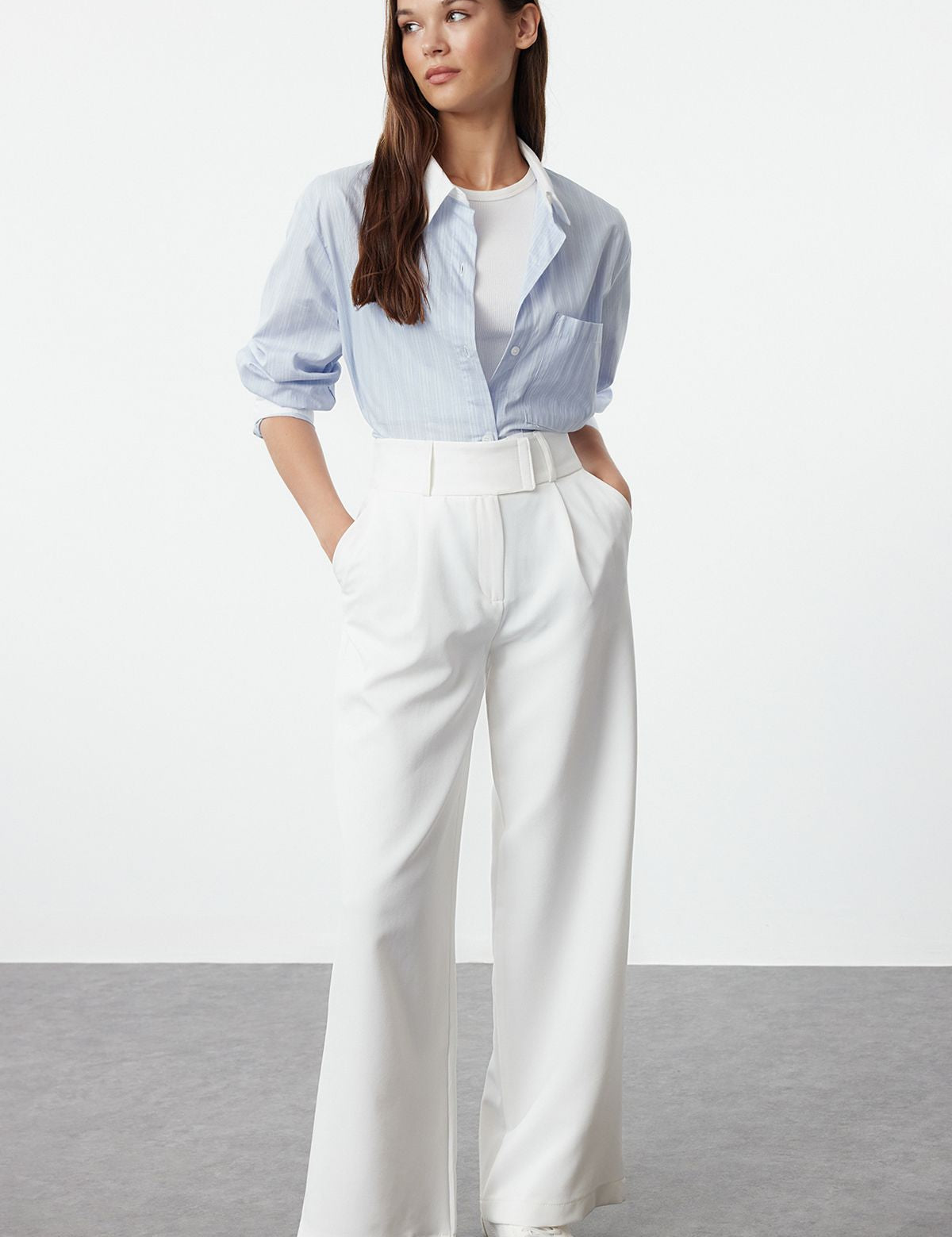 Elevate your style with these elegant high-waist wide-leg white trousers for women. Perfect for office wear or casual outings, these versatile pants offer comfort and sophistication. Shop now for a chic wardrobe essential!