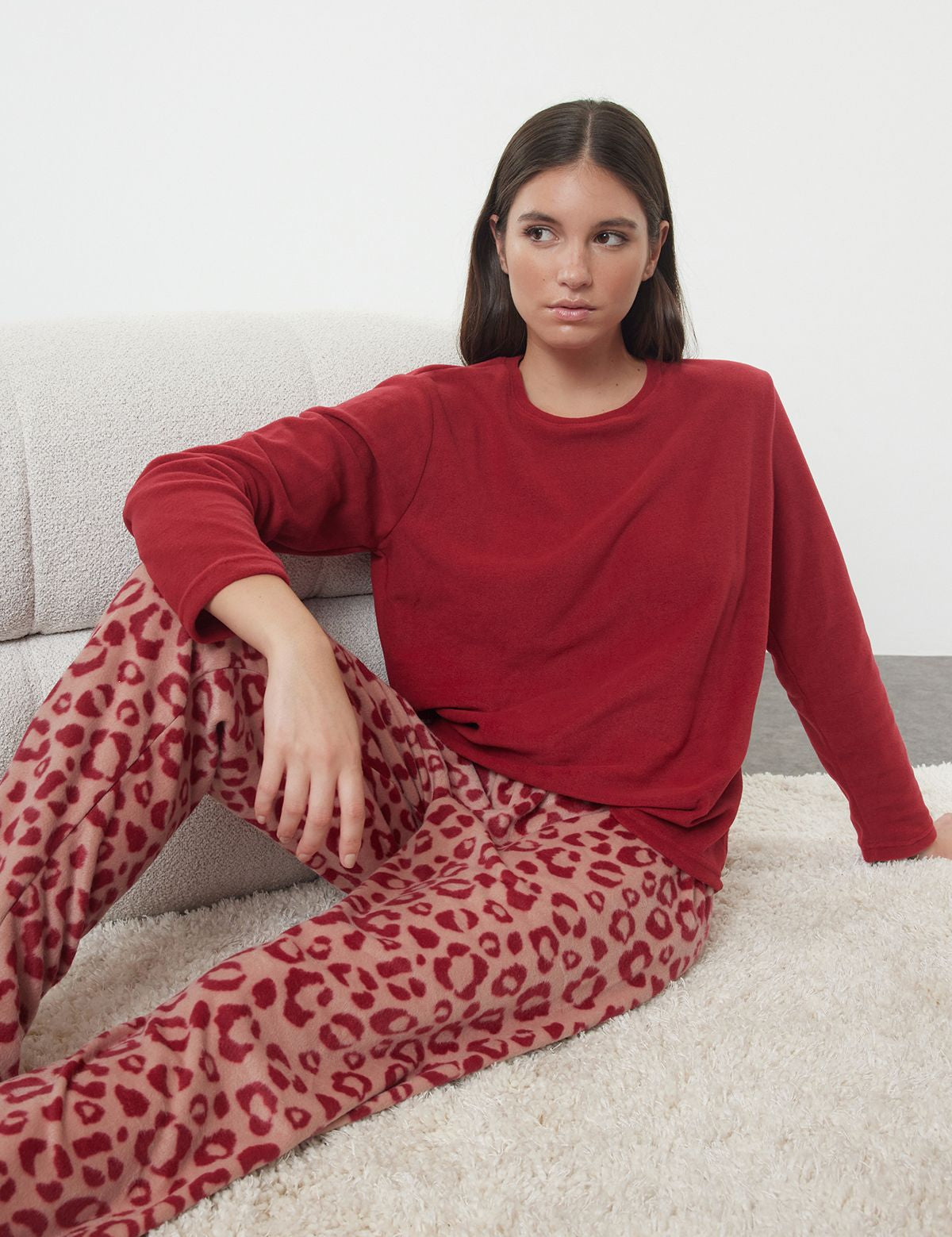 Get cozy in our red leopard print fleece pajama set. Featuring a soft fleece top and stylish printed pants, perfect for winter nights or lounging at home. Shop now!