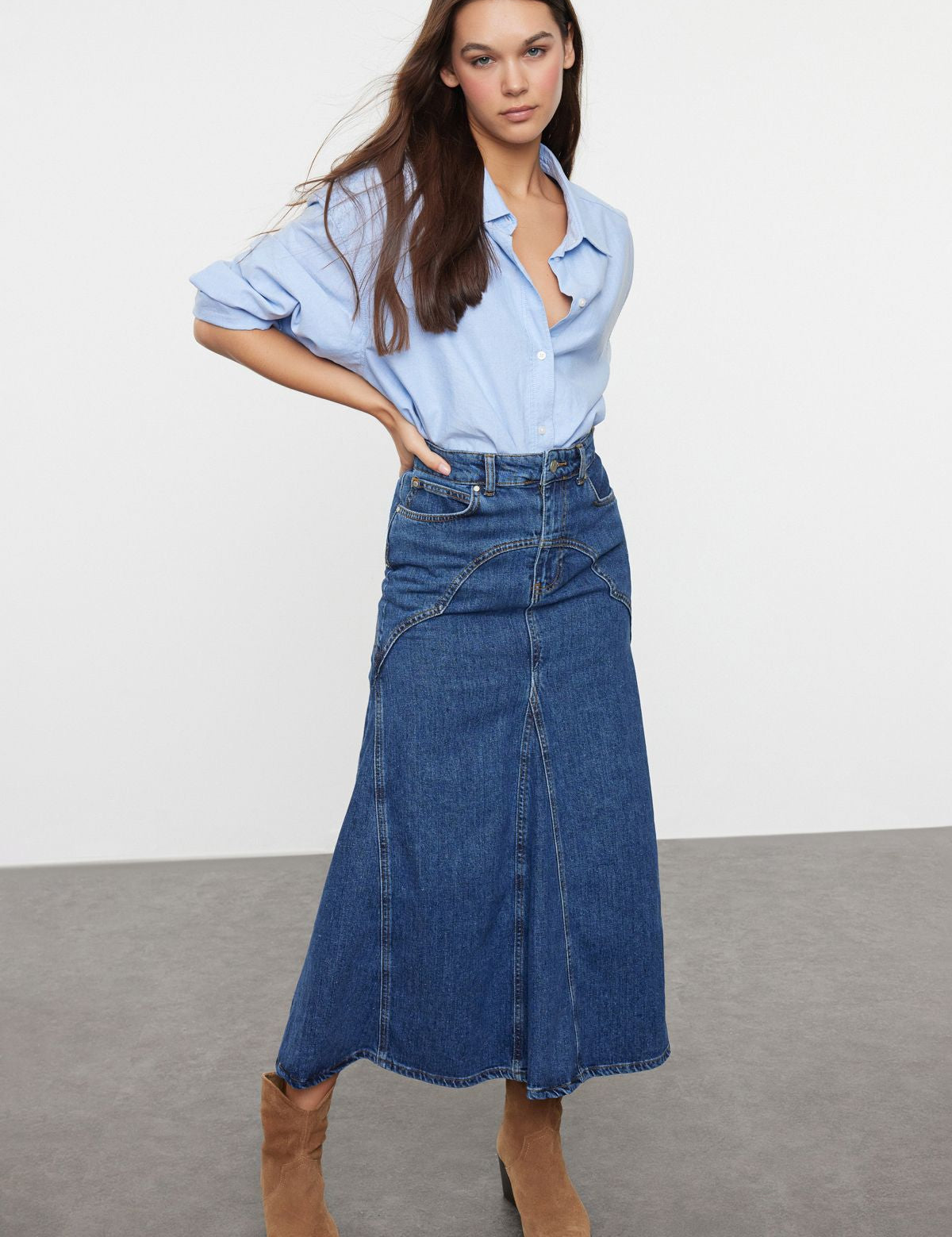 Step up your casual style with this high-waisted denim A-line maxi skirt. Perfect for versatile wear, this skirt combines classic denim with a flattering A-line silhouette. Shop now to add a timeless piece to your collection!