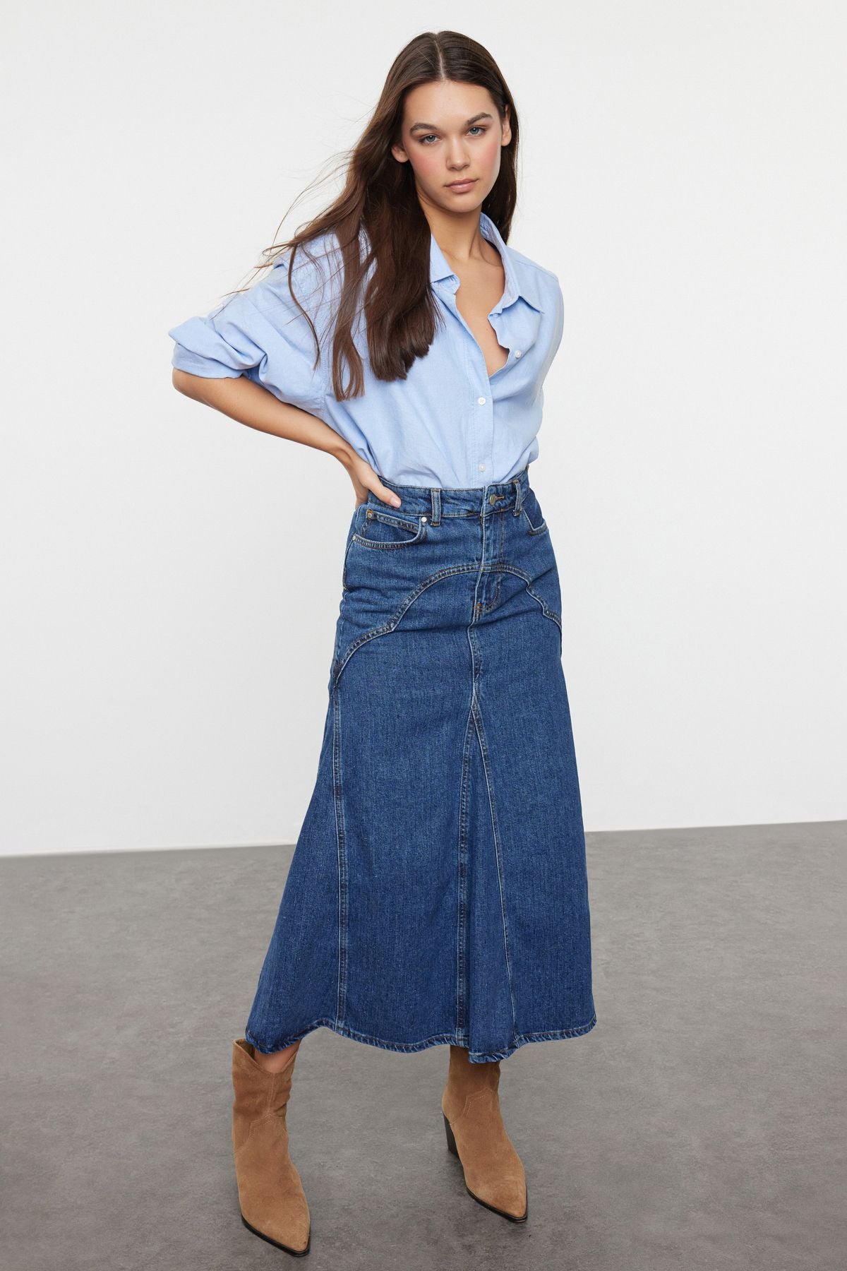 Step up your casual style with this high-waisted denim A-line maxi skirt. Perfect for versatile wear, this skirt combines classic denim with a flattering A-line silhouette. Shop now to add a timeless piece to your collection!