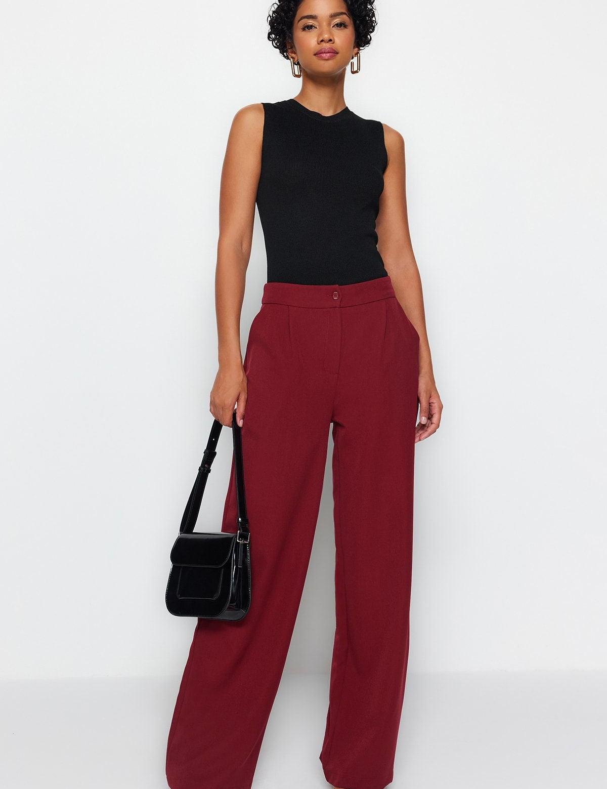 Discover sophisticated style with our High-Waisted Wide Leg Trousers in burgundy. These tailored pants offer a chic, versatile look perfect for work or casual wear. Shop now for a refined wardrobe update!