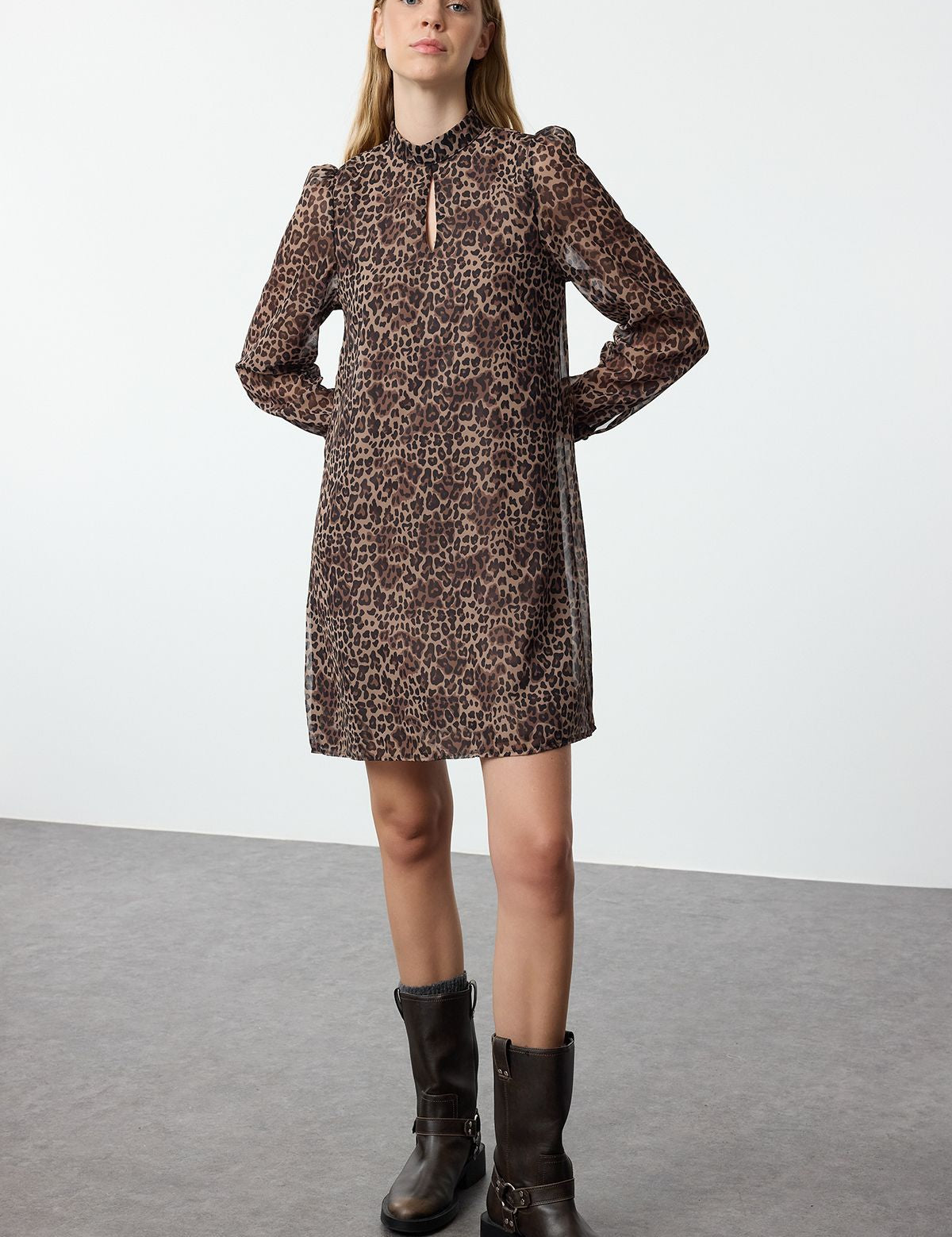 Turn heads with our Leopard Print Long Sleeve Shift Dress. Featuring a chic animal print, sheer sleeves, and a relaxed fit, this dress is perfect for any occasion. Shop now to add a bold touch to your wardrobe free shipping!