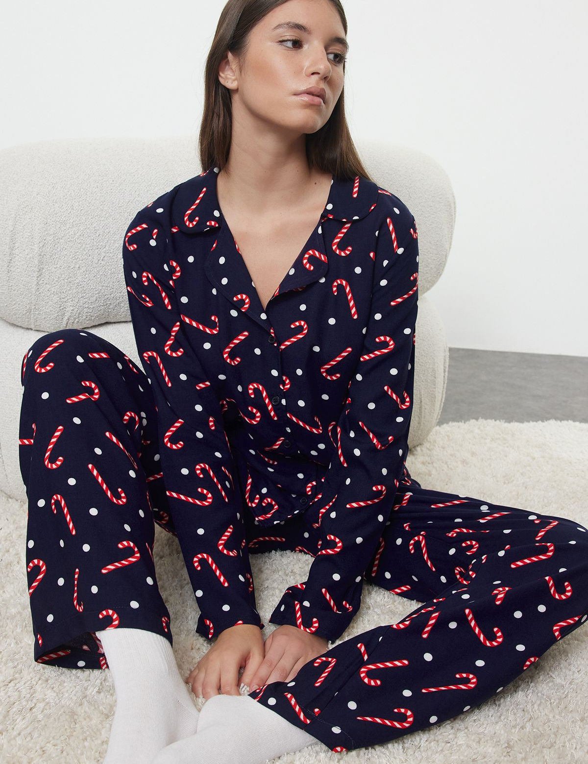 Get festive with our women’s candy cane print pajama set. Perfect for holiday mornings and cozy nights, featuring a fun polka dot design. Shop now for the season!