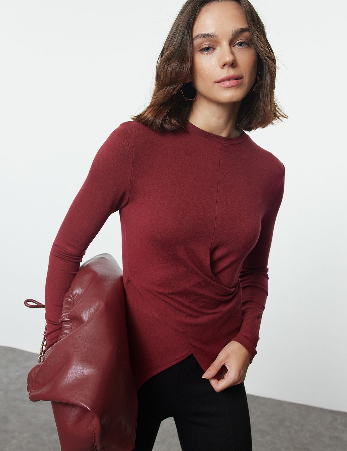 
Elevate your style with our Asymmetric Twist-Front Long Sleeve Top in burgundy. This chic blouse features a unique draped front and modern asymmetric hem. Perfect for any occasion, shop now!

