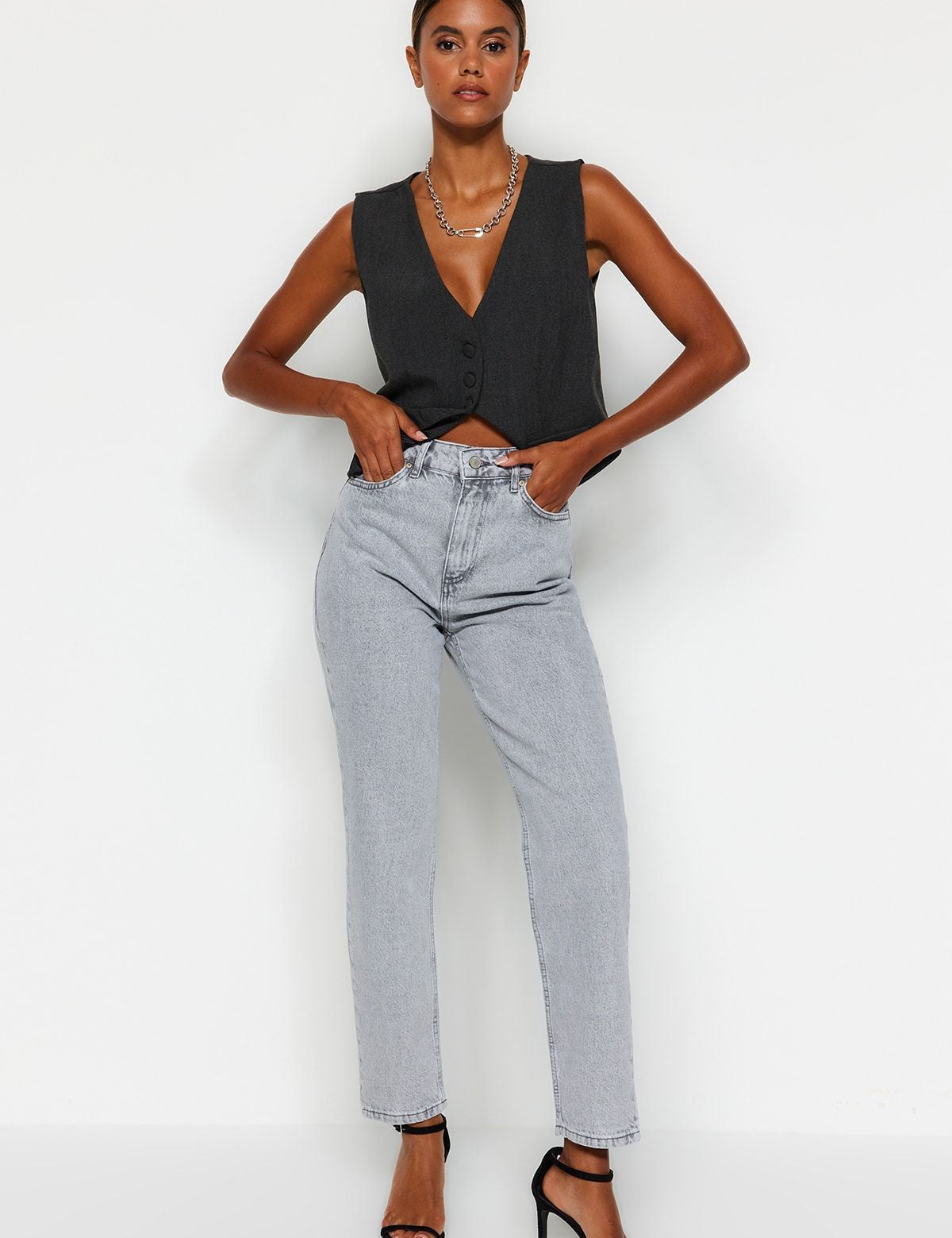 Shop our Women’s High-Waisted Light Wash Mom Jeans. These relaxed, straight-leg jeans feature a high-rise fit and trendy light-wash finish, perfect for casual wear or smart-casual styling.