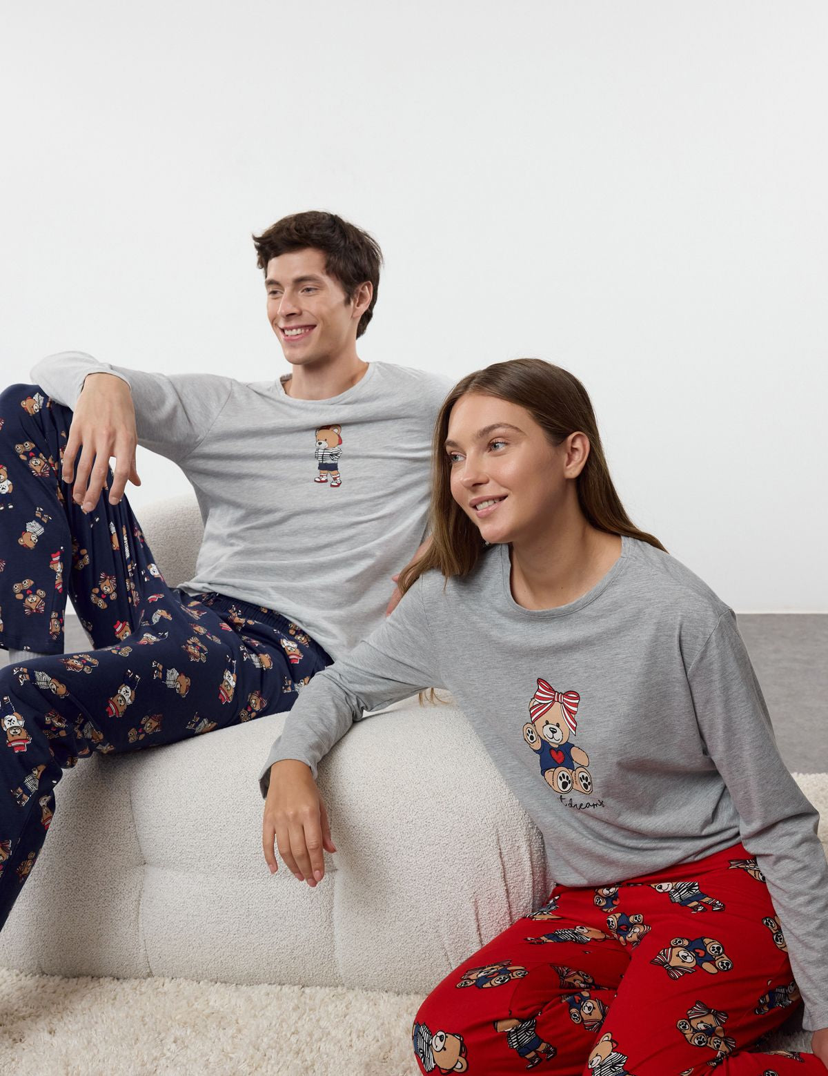 Stay cozy with our women’s bear print pajama set. Featuring a cute grey top with bear graphics and red printed pants, perfect for bedtime or lounging. Shop now!