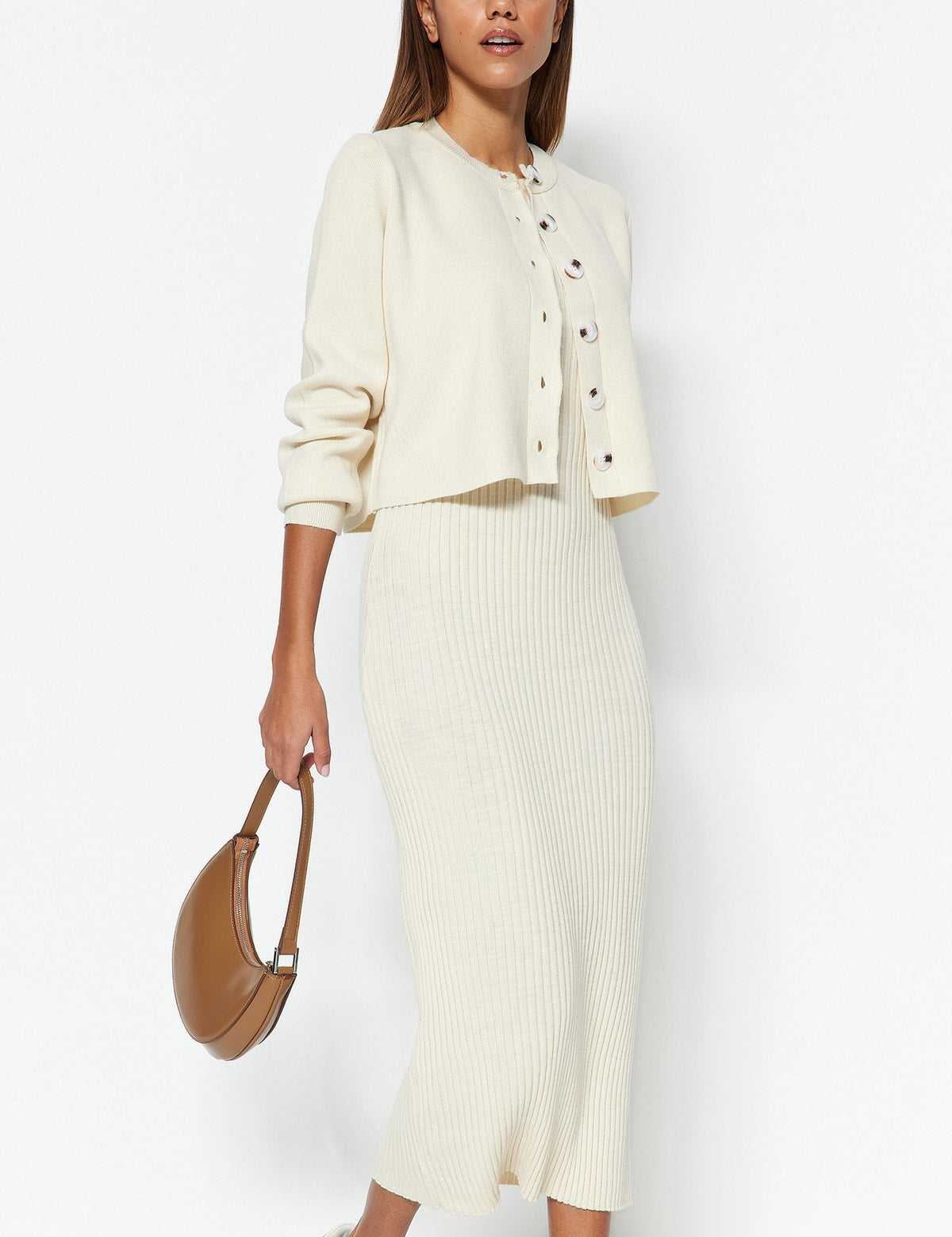 Discover the Cream Ribbed Knit Cardigan and Midi Dress Set for effortless style and comfort. Perfect for any occasion, this versatile outfit is a must-have addition to your wardrobe