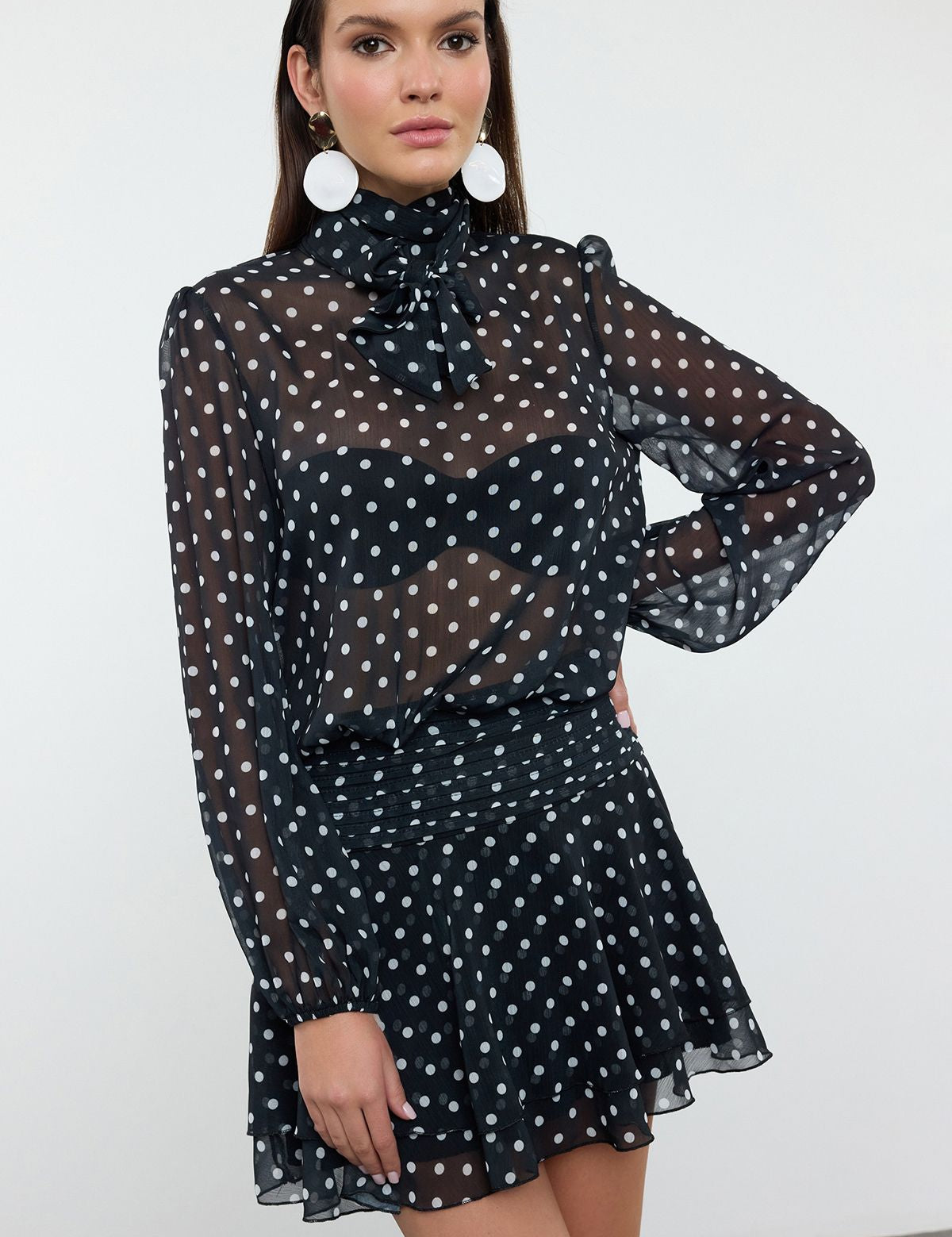 Sheer polka dot blouse
	•	Black and white polka dot set
	•	Polka dot skirt and blouse outfit
	•	Elegant evening polka dot set
	•	Sheer blouse with bow-tie neck
	•	Ruffled skirt polka dot set
	•	Women’s semi-formal polka dot outfit
	•	Black and white polka dot blous