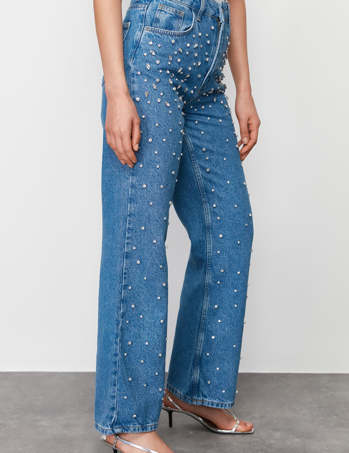 Make a stylish statement with our high-waisted pearl embellished jeans. Featuring a straight-leg fit and delicate pearl accents, perfect for any occasion. Shop now!