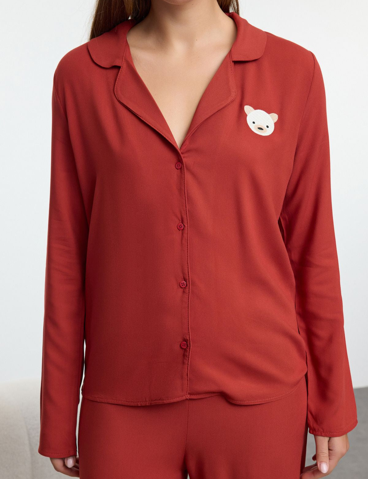 Minimalist red pajama set for women
	•	Button-up lounge set with bear graphic
	•	Cozy women’s two-piece sleepwear
	•	Relaxed fit pajamas for women
	•	Lightweight red pajama set with top and pants
	•	Women’s lounge outfit for home
	•	Cute bear detail sleepwear gift
	•	Comfortable sleepwear for women
	•	Relaxed button-up sleep set
	•	Stylish pajamas for lounging