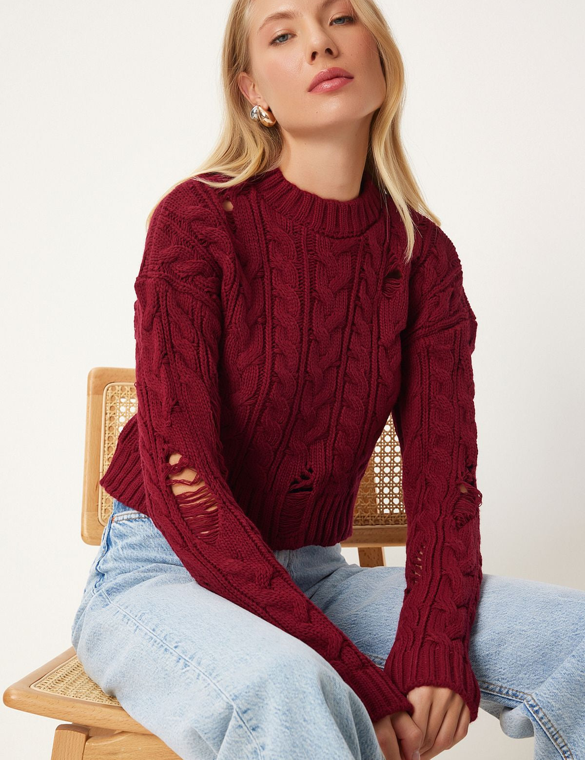 Stand out with our Distressed Cable Knit Sweater in rich burgundy. Featuring chunky knit and unique distressed details, this cozy pullover is perfect for any stylish fall or winter look. Shop now for a bold fashion statement free shipping!