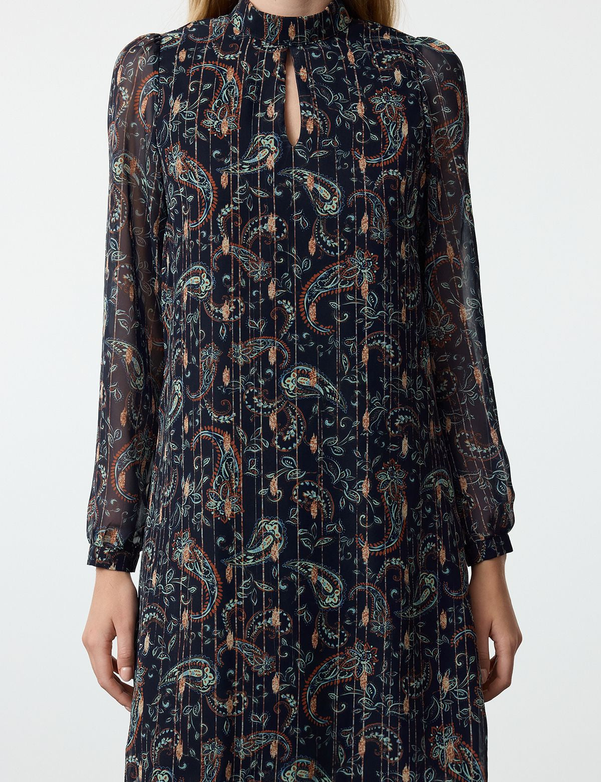 Discover boho elegance with our Paisley Print Long Sleeve Dress. Featuring a beautiful paisley pattern, sheer sleeves, and a flattering mini silhouette, this dress is perfect for any season. Shop now for versatile, casual-chic style!