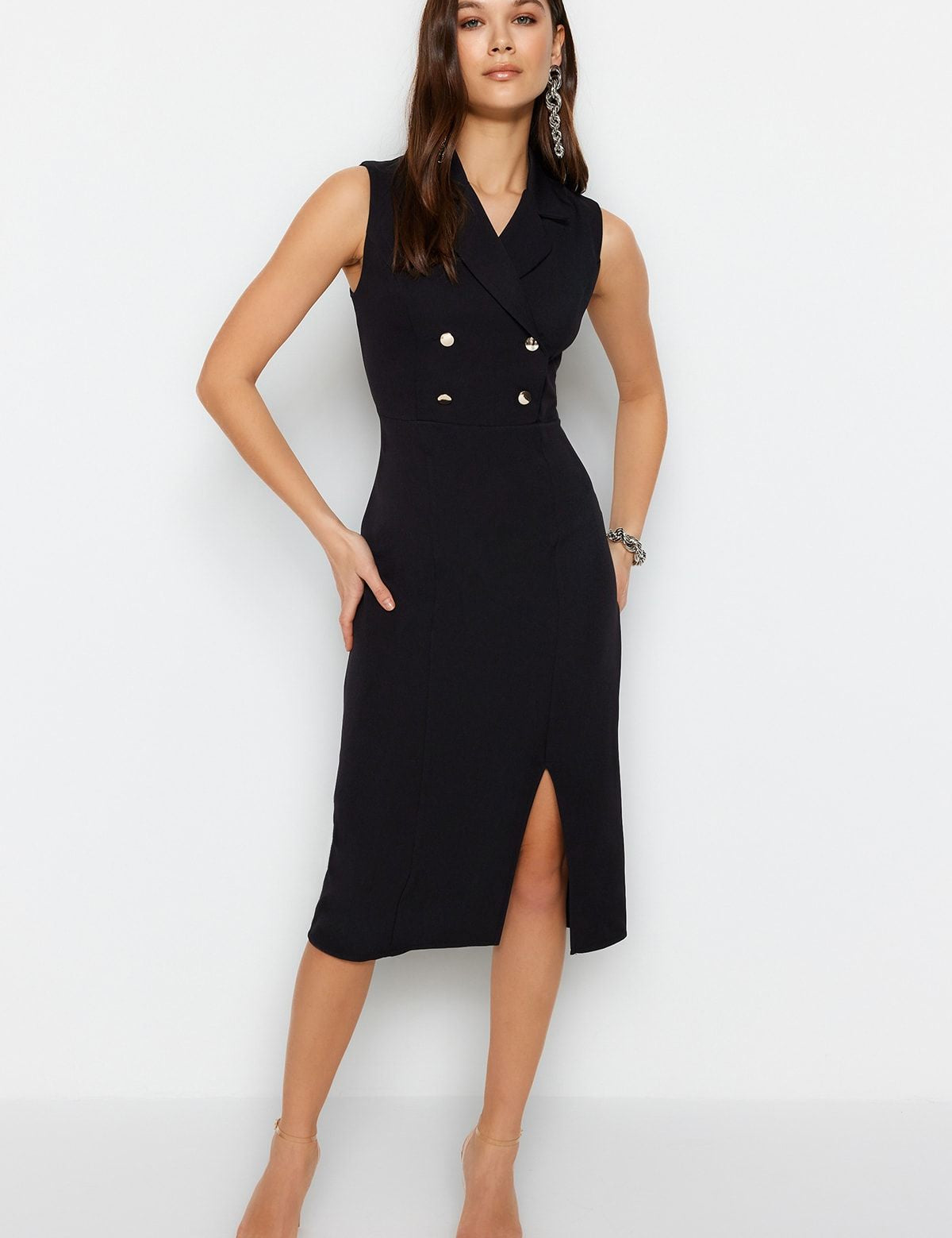 Discover our Elegant Black Double-Breasted Sleeveless Midi Dress, perfect for formal events or evening outings. A stylish blend of classic and modern, available in various sizes.