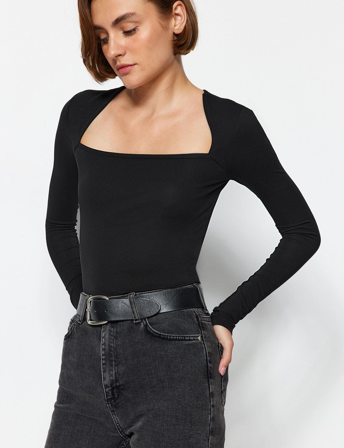 Enhance your wardrobe with our Black Square Neck Long Sleeve Top. This fitted, stylish basic offers a sleek silhouette, perfect for any occasion. Made from soft stretch fabric for ultimate comfort. Shop now for effortless elegance free shipping!
