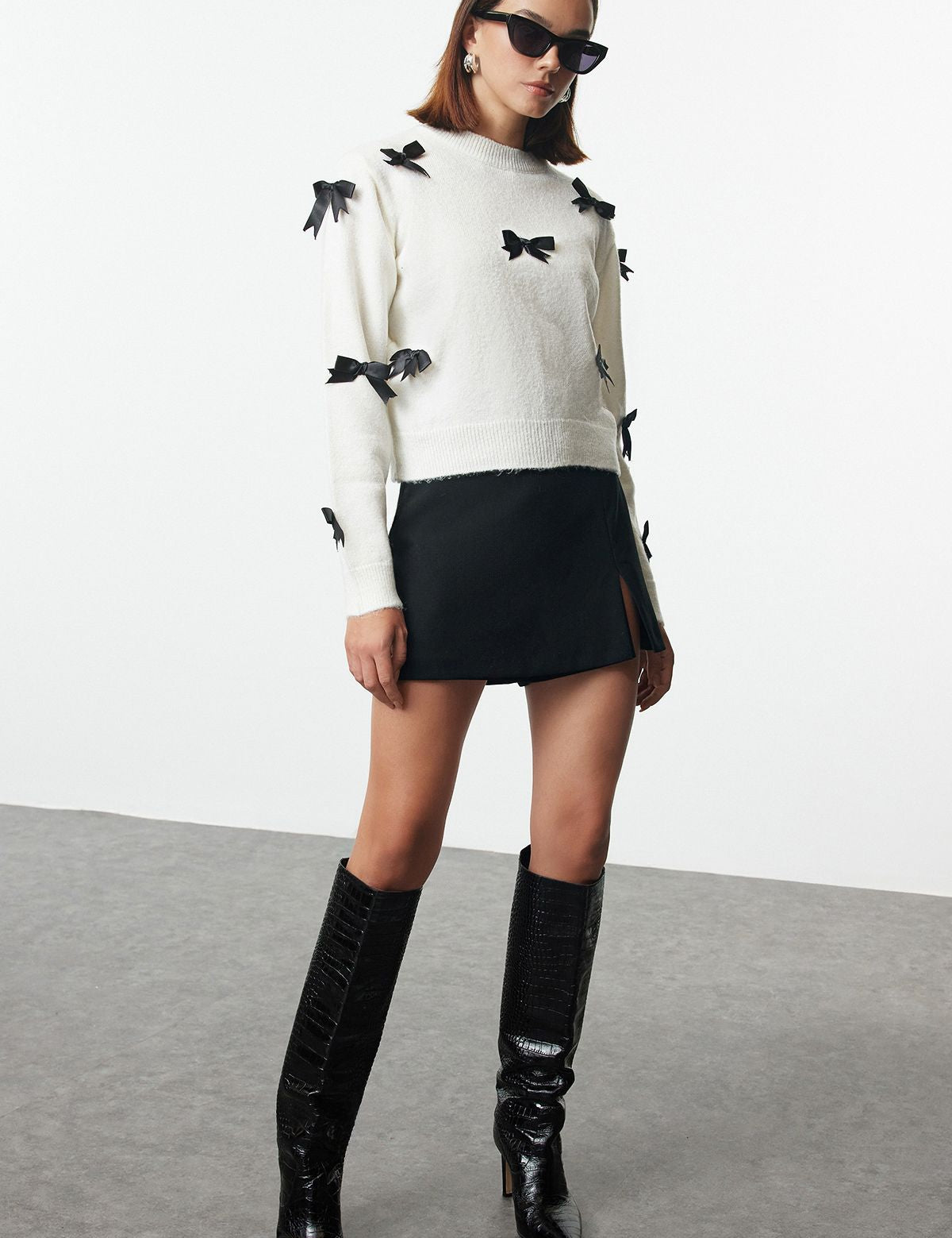 White Sweater with Black Bow Accents - Chic Knitwear