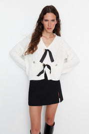 White Cable Knit Cardigan with Black Bow Tie Detail - Cozy Cropped Sweater