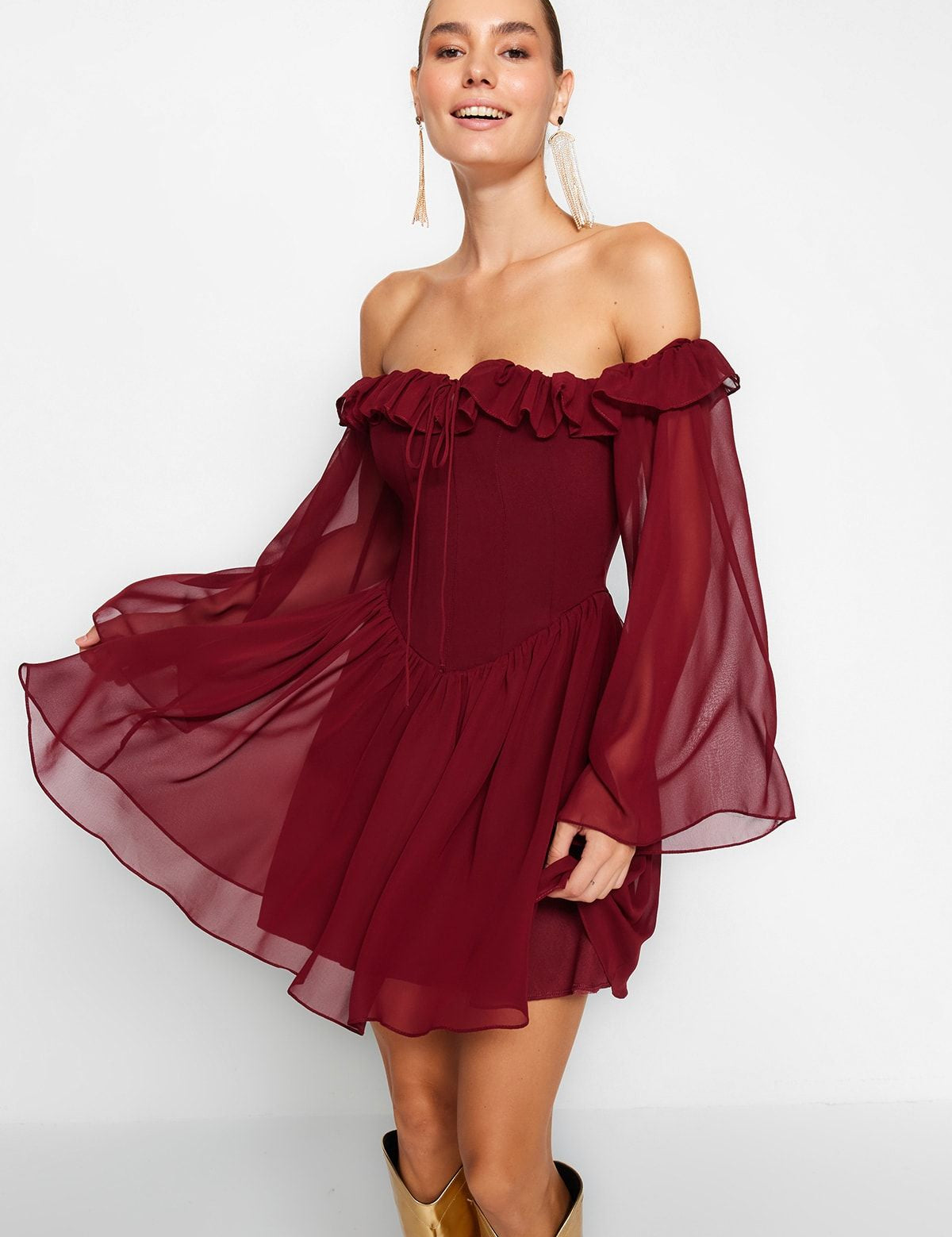 Make a statement with our Off-Shoulder Burgundy Chiffon Dress. Featuring a flowy silhouette, ruffle details, and sheer balloon sleeves, this elegant mini dress is perfect for parties and special occasions. Shop now for timeless style! Free shipping!