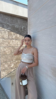 Discover our Chic Beige Strappy Crop Top with Embroidered Detailing, designed for style and comfort. This versatile top is perfect for summer outings and adds a sophisticated touch to your wardrobe. Shop now for a chic and trendy look enjoy free shipping!