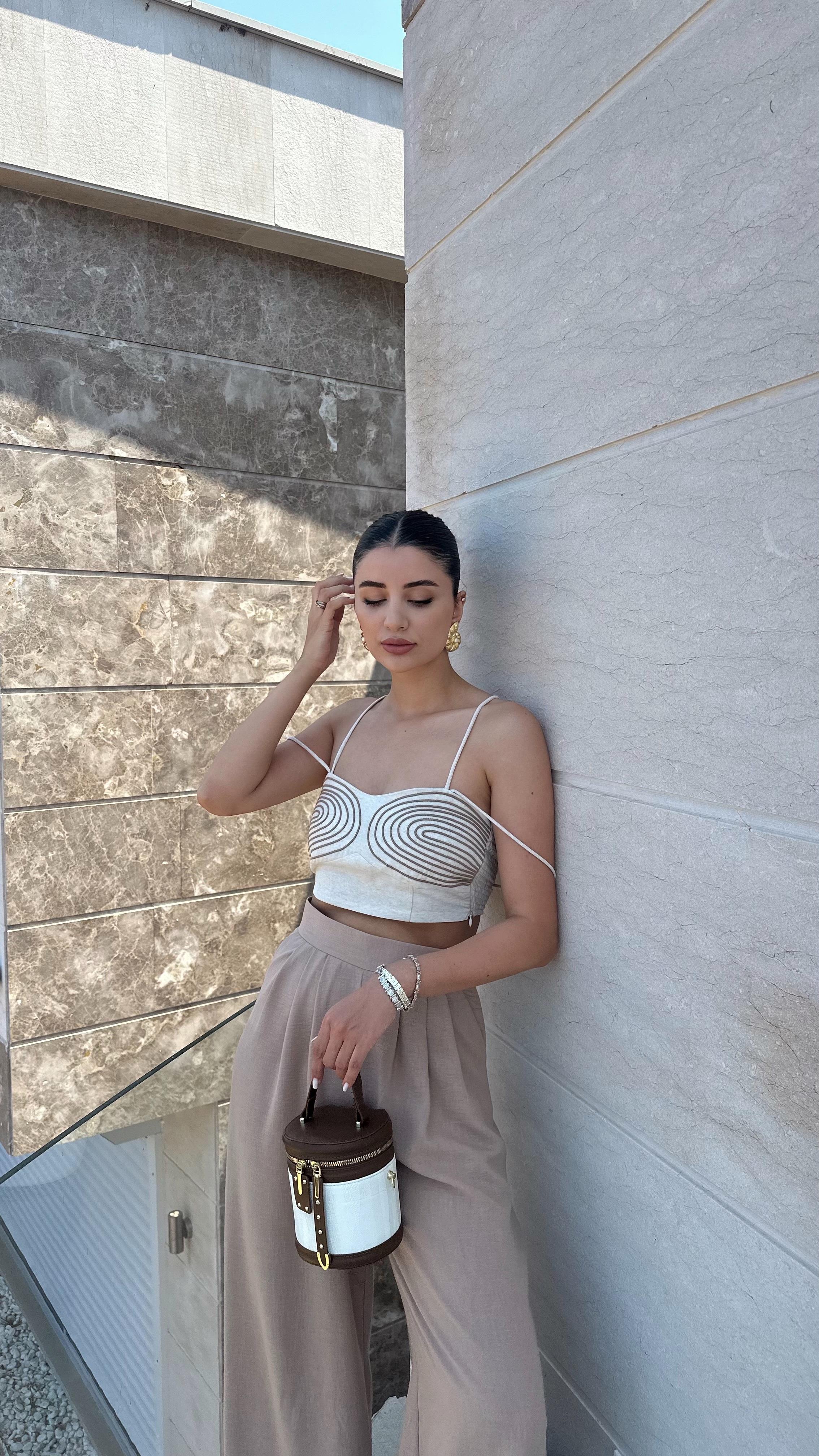 Discover our Chic Beige Strappy Crop Top with Embroidered Detailing, designed for style and comfort. This versatile top is perfect for summer outings and adds a sophisticated touch to your wardrobe. Shop now for a chic and trendy look enjoy free shipping!