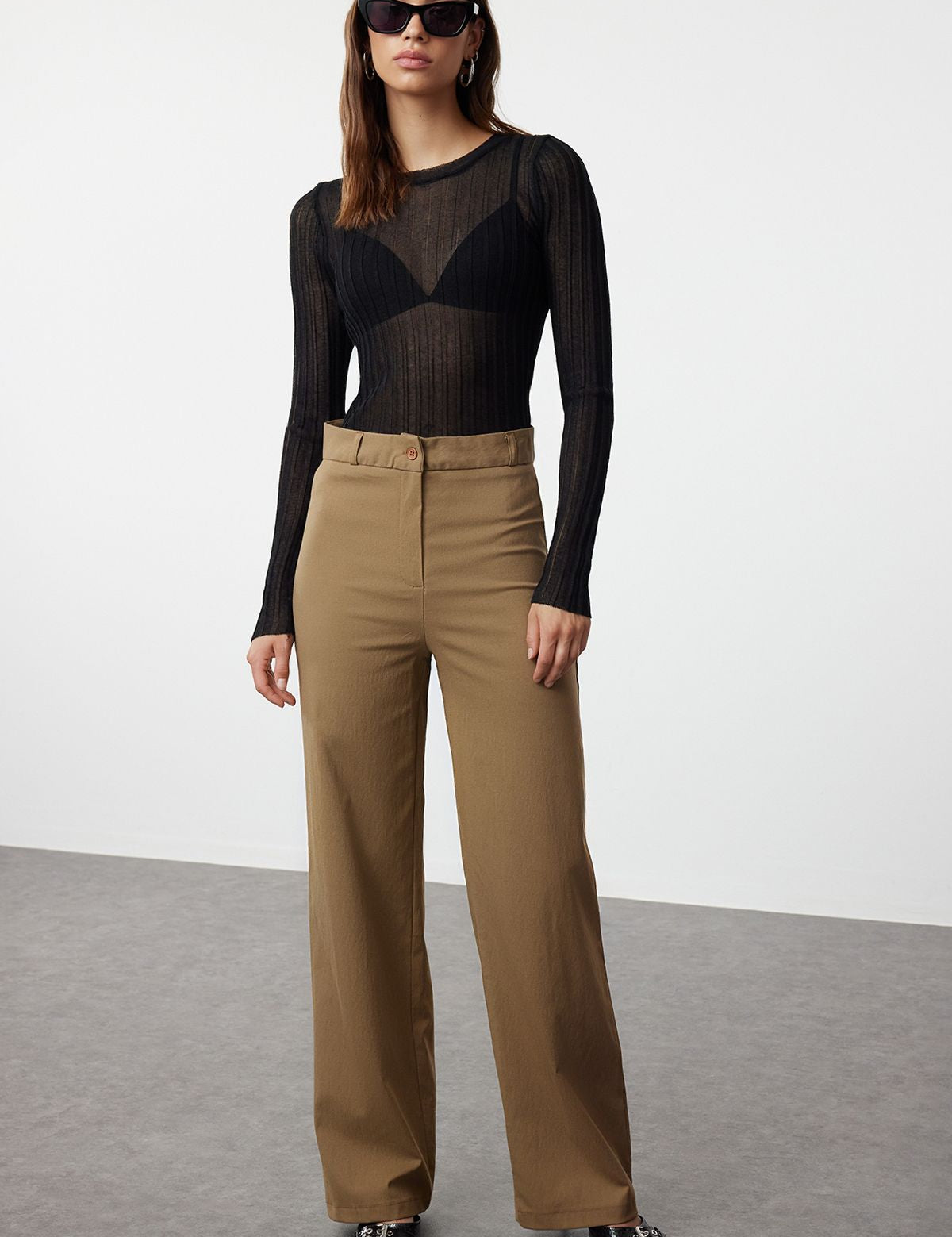  
Elevate your style with our High-Waisted Wide-Leg Trousers. Featuring a flattering high waist, wide-leg fit, and versatile brown color, these sophisticated pants are perfect for any occasion. Shop now for chic and comfortable women’s trousers!