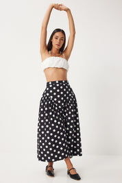 Shop our chic polka dot high-waisted midi skirt, featuring a classic black and white pattern, flattering A-line silhouette, and convenient pockets. Perfect for casual outings or stylish get-togethers. Explore versatile women’s fashion now!