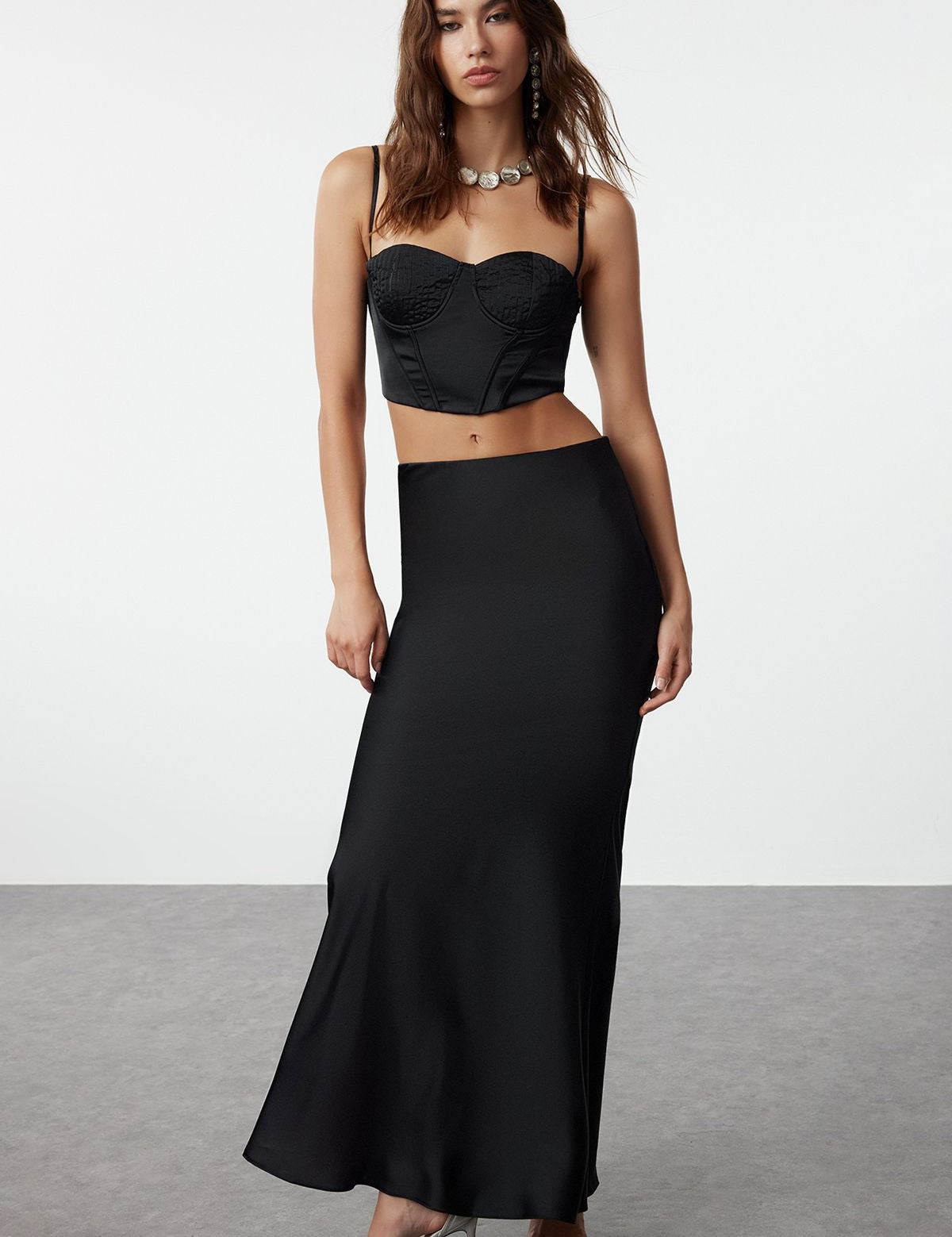 
Shop our elegant black bustier and maxi skirt set, perfect for evening events and special occasions. This sophisticated two-piece ensemble features a fitted bustier top and a sleek maxi skirt, offering modern elegance and timeless style.