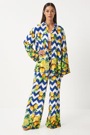  Make a bold statement with our Lemon Print Two-Piece Set. Featuring a playful lemon print on a striking chevron pattern, this vibrant and comfortable set is perfect for casual outings and summer parties. Shop now for stylish and fun fashion!
