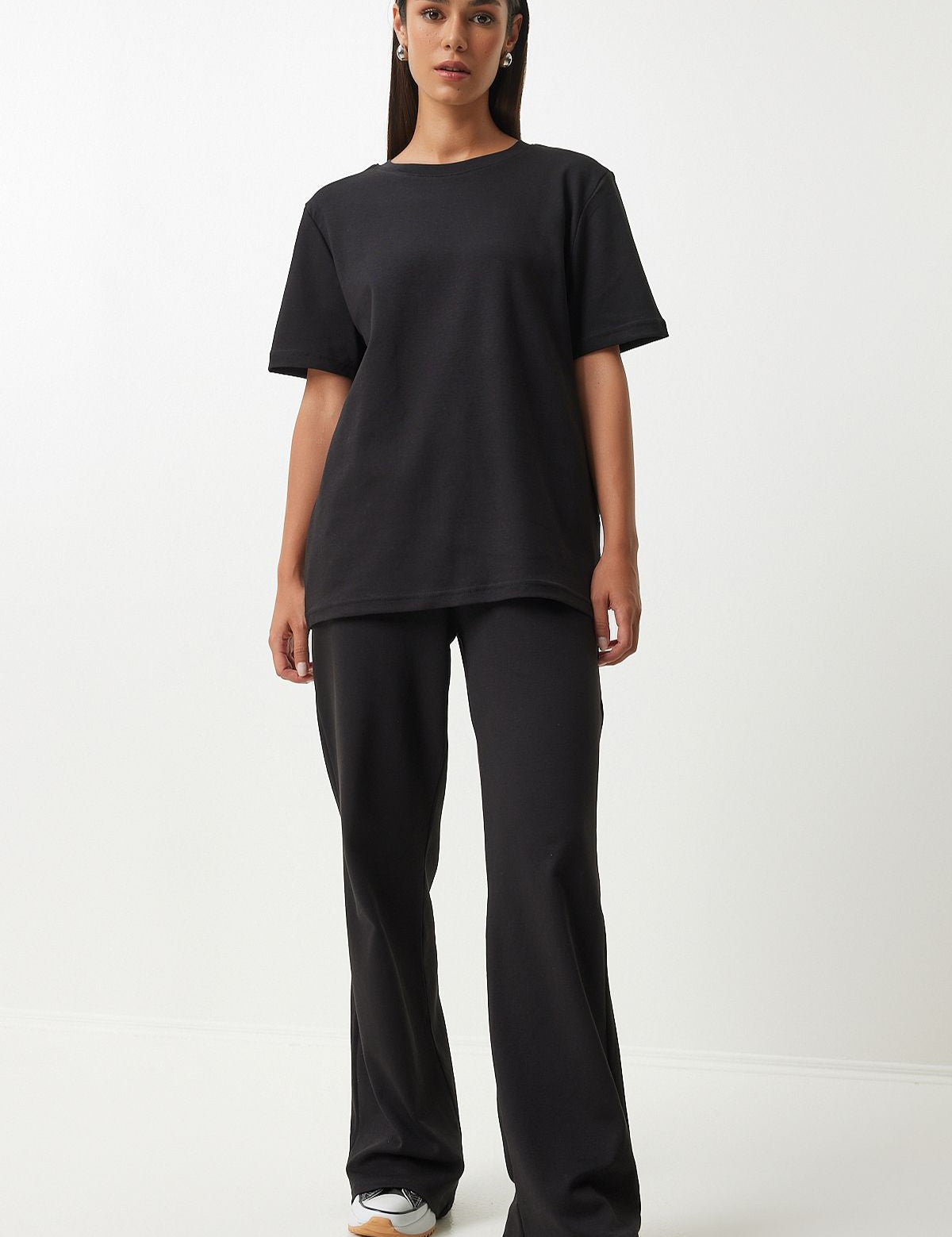  Embrace comfort and style with our Classic Black Loungewear Set. Featuring a relaxed-fit T-shirt and wide-leg pants, this sleek and versatile set is perfect for lounging or casual outings. Shop now for stylish and comfortable loungewear!