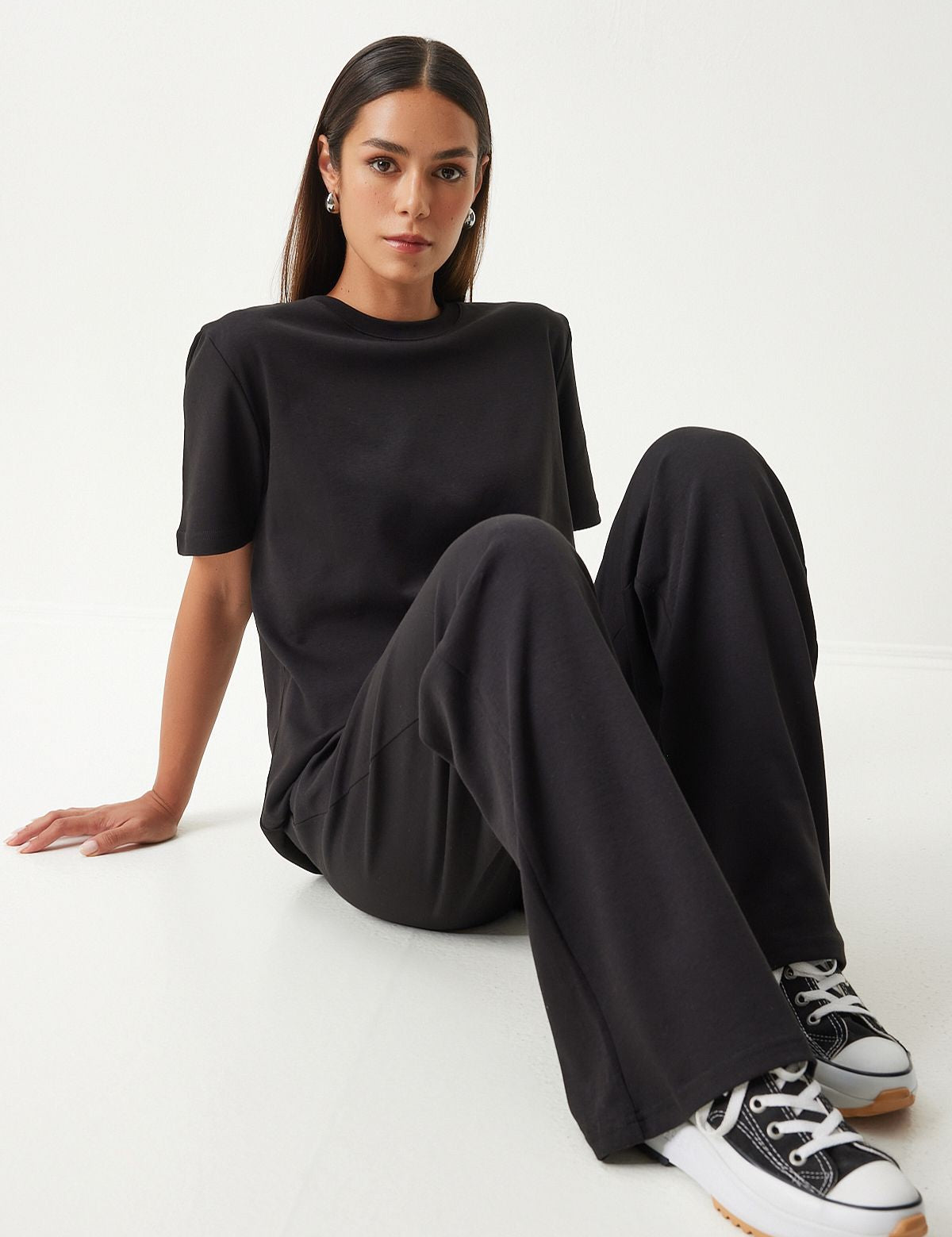  Embrace comfort and style with our Classic Black Loungewear Set. Featuring a relaxed-fit T-shirt and wide-leg pants, this sleek and versatile set is perfect for lounging or casual outings. Shop now for stylish and comfortable loungewear!