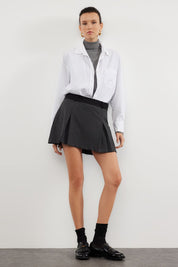 Discover our Chic Grey Pleated Skort, perfect for versatile fashion. Combining the look of a skirt with the comfort of shorts, this high-waisted skort is ideal for casual and semi-formal occasions. Shop now for stylish women’s fashion!