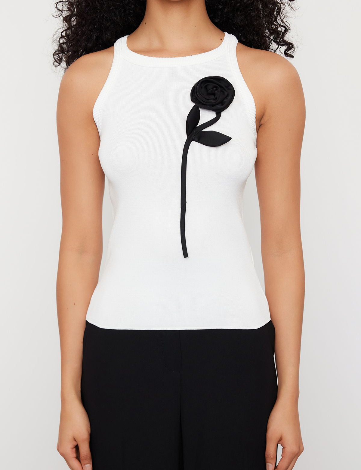 
           Ribbed tank top with floral 
            appliqué
	•	White fitted tank top for women
	•	Elegant black and white top
	•	Stylish women’s tops for 
             summer
	•	Versatile ribbed tank tops