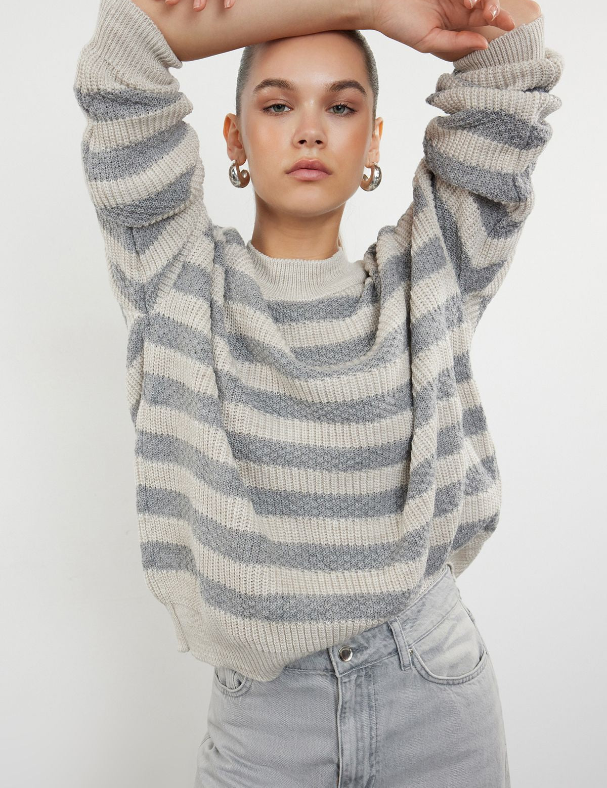  Wrap yourself in comfort with our Cream and Gray Striped Sweater. Featuring a timeless stripe pattern and a soft wool blend, this cozy knit sweater is perfect for layering and adding sophistication to your casual wardrobe. Shop now for elegant and stylish knitwear free shipping!