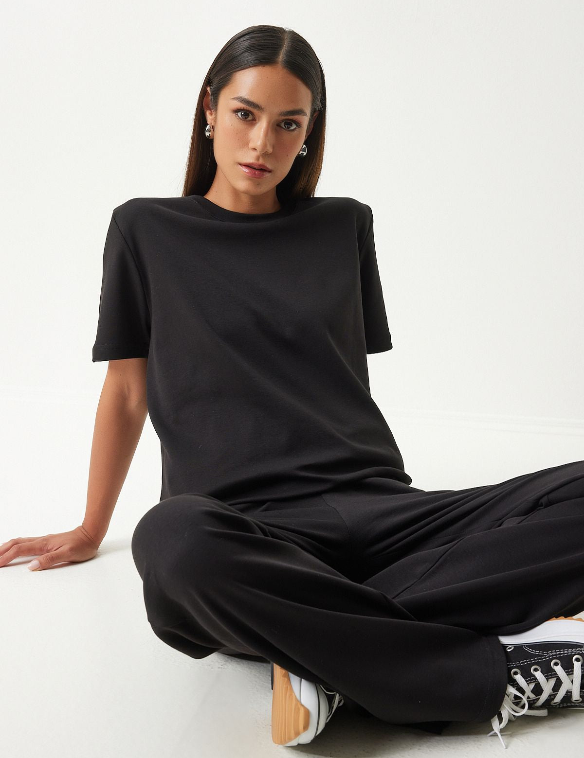 Black loungewear set
• Women’s casual loungewear
• Relaxed-fit T-shirt and pants
• Comfortable lounge set
• Minimalist black outfit
• Soft cotton blend loungewear
• Versatile casual wear
• Stylish home wear
• Wide-leg pants set