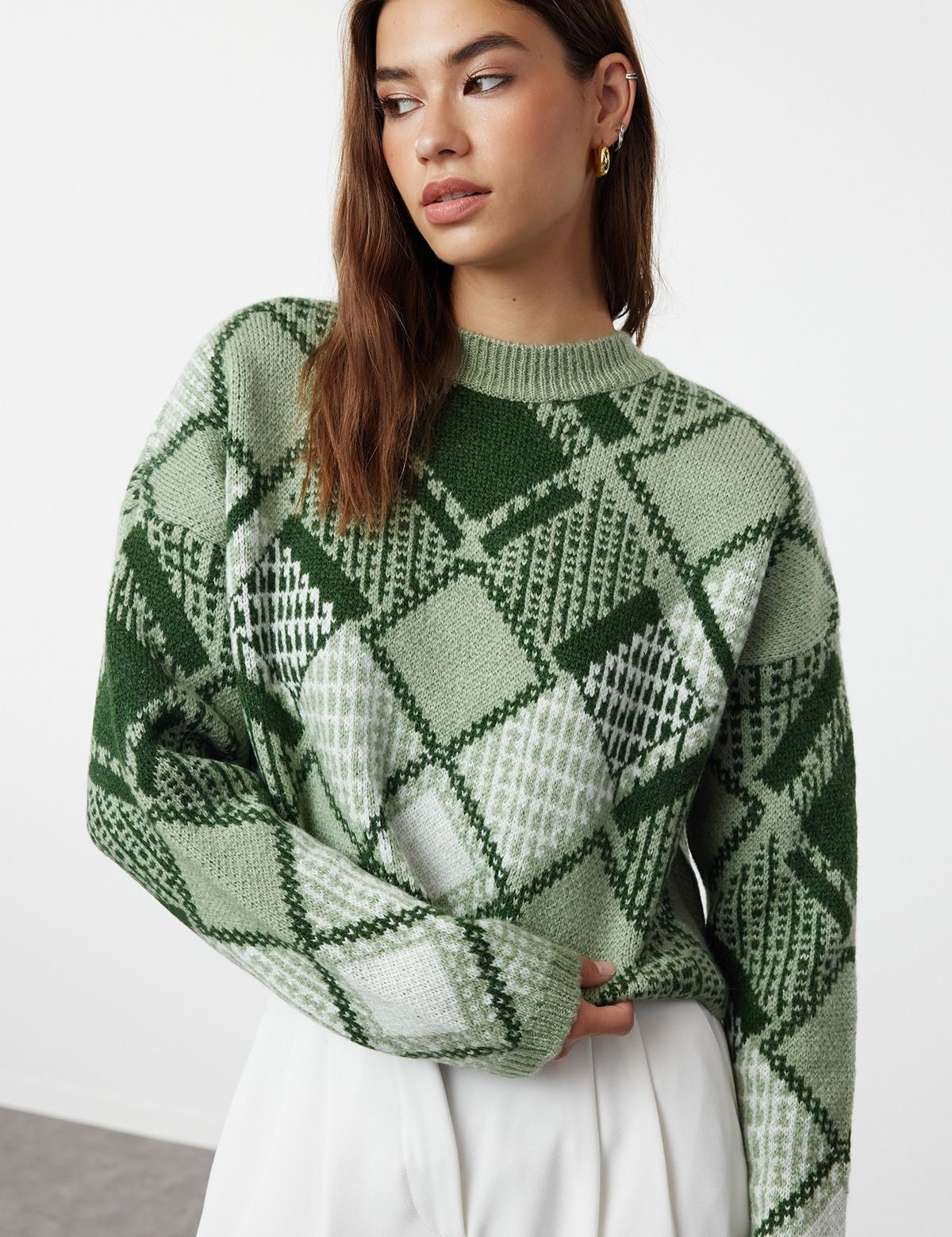 Cozy up in our Green Argyle Knit Sweater. Featuring a bold checkered pattern and a relaxed, oversized fit, this stylish pullover is perfect for any casual occasion. Shop now for chic winter style free shipping!
