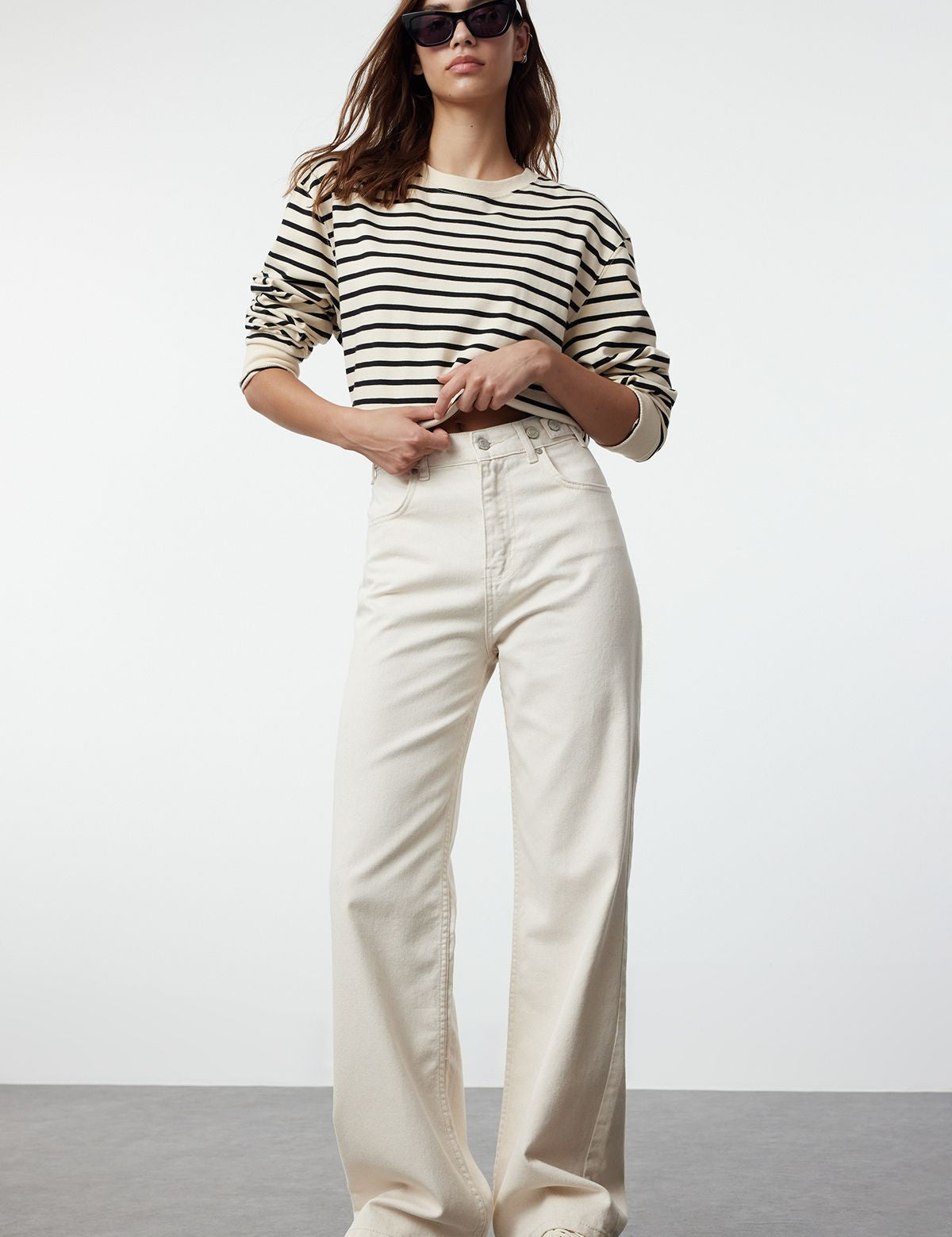 Elevate your style with our High-Waisted Cream Wide-Leg Jeans. Perfect for casual and semi-formal occasions, these trendy jeans offer a flattering fit and sophisticated look. Shop now for high-quality women’s denim, enjoy free shipping!